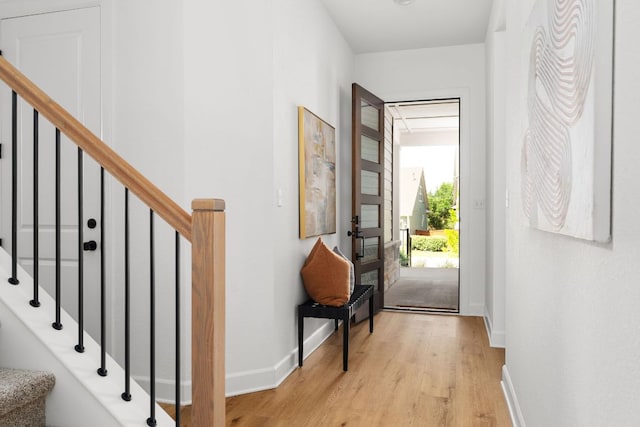 352 Moonlit Stream Pass, Dripping Springs, TX 78620 - entrance foyer featuring light wood-style floors and stairway