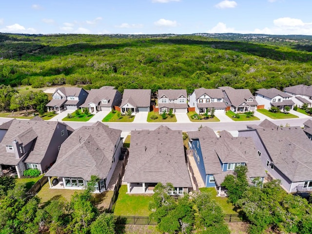 352 Moonlit Stream Pass, Dripping Springs, TX 78620 - aerial perspective of suburban area featuring a heavily wooded area