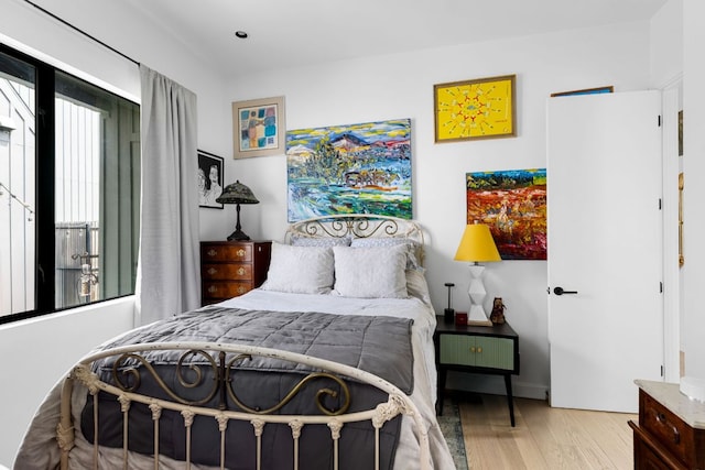 5509 Clay Ave Unit 2, Austin, TX 78756 - bedroom with wood finished floors and baseboards