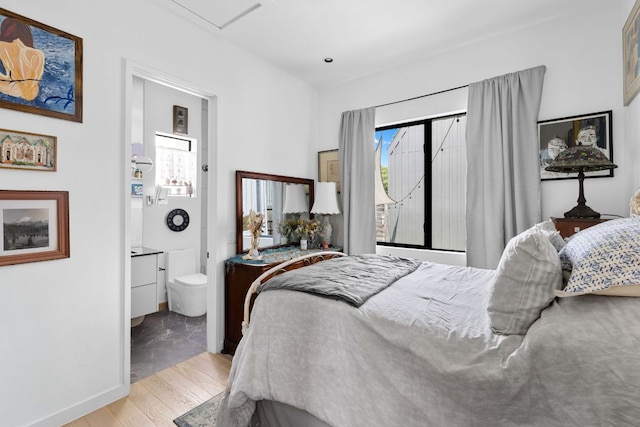 5509 Clay Ave Unit 2, Austin, TX 78756 - bedroom with ensuite bathroom and light wood finished floors