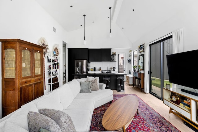 5509 Clay Ave Unit 2, Austin, TX 78756 - living room featuring high vaulted ceiling, light wood-type flooring, and beamed ceiling