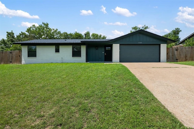 1101 Floradale Dr, Austin, TX 78753 - ranch-style house with concrete driveway, a garage, board and batten siding, and brick siding