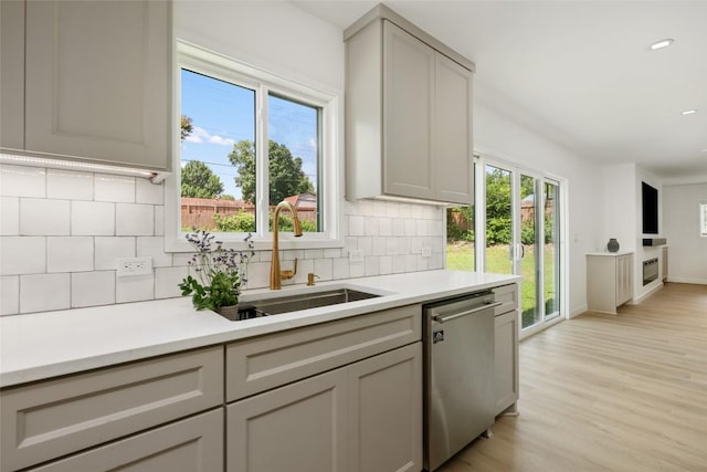 1101 Floradale Dr, Austin, TX 78753 - kitchen featuring dishwasher, tasteful backsplash, light countertops, and recessed lighting