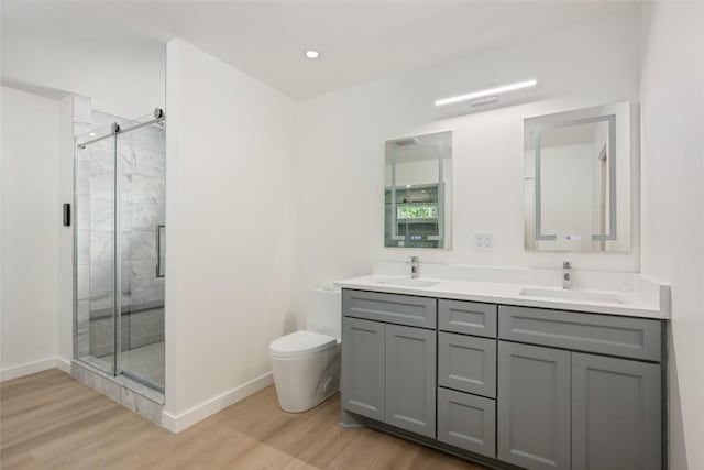 1101 Floradale Dr, Austin, TX 78753 - full bath with wood finished floors, a shower stall, and double vanity