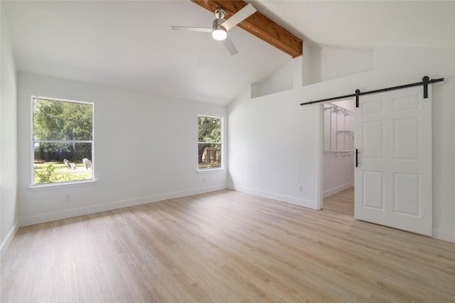 2502 W Messick Loop, Round Rock, TX 78681 - empty room featuring a barn door, beam ceiling, ceiling fan, light wood-type flooring, and high vaulted ceiling