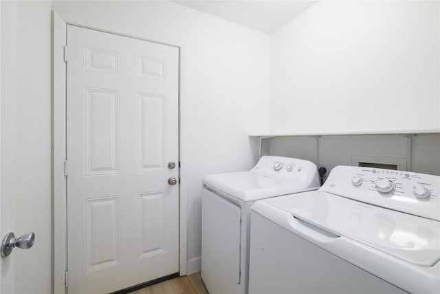 2502 W Messick Loop, Round Rock, TX 78681 - laundry room with separate washer and dryer and light wood-style floors