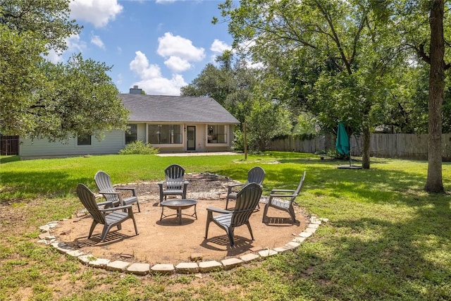 2502 W Messick Loop, Round Rock, TX 78681 - fenced backyard with an outdoor fire pit and a patio area