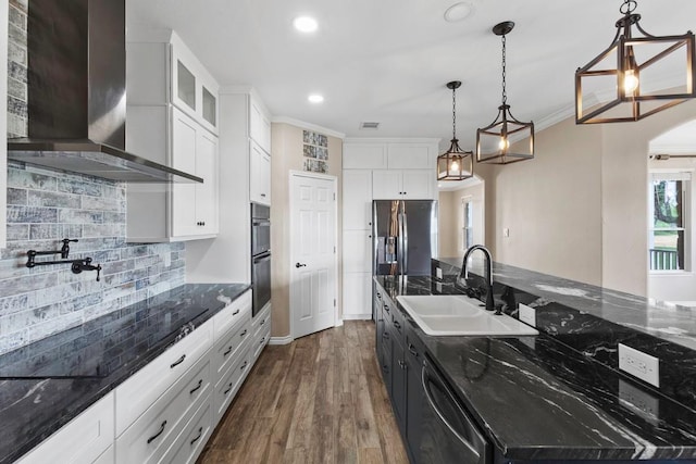 15020 Hero Way W, Leander, TX 78641 - kitchen with wall chimney range hood, stainless steel appliances, white cabinets, recessed lighting, and tasteful backsplash