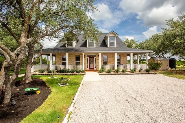 15020 Hero Way W, Leander, TX 78641 - country-style home featuring covered porch, a shingled roof, and a front yard