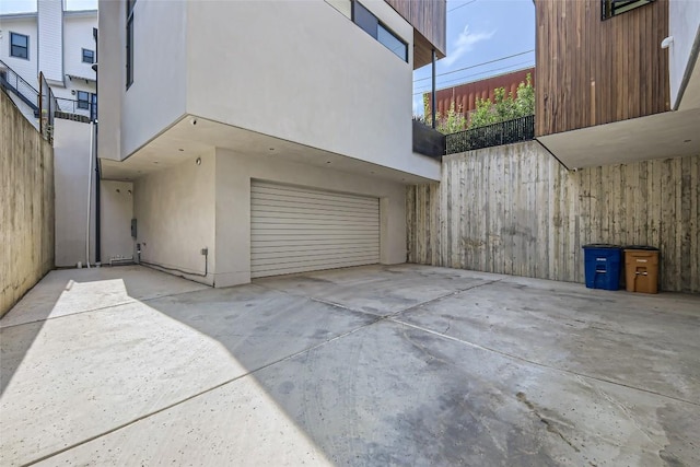 1315 W 9th St Unit B, Austin, TX 78703 - view of side of home with stucco siding and an attached garage