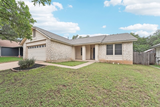 12404 Wycliff Ln, Austin, TX 78727 - ranch-style home with stone siding, an attached garage, and driveway