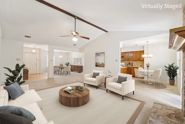 12404 Wycliff Ln, Austin, TX 78727 - living area with a chandelier, a ceiling fan, and light carpet