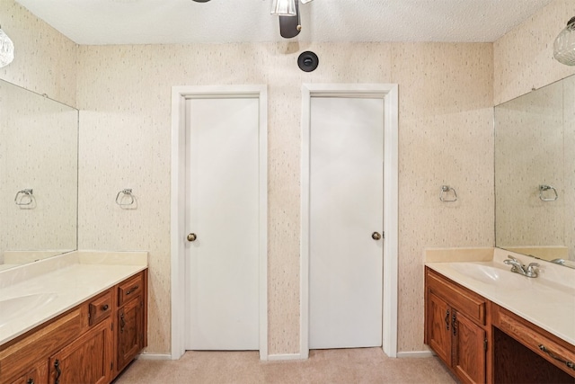 12404 Wycliff Ln, Austin, TX 78727 - full bathroom with two vanities and a ceiling fan