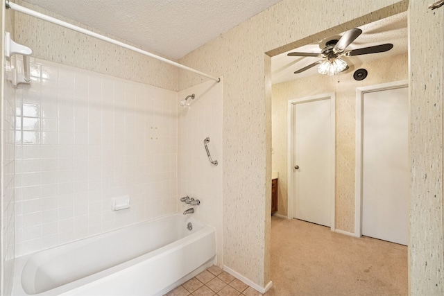 12404 Wycliff Ln, Austin, TX 78727 - bathroom featuring bathing tub / shower combination, a ceiling fan, a textured ceiling, and tile patterned floors