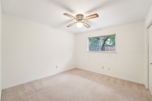 12404 Wycliff Ln, Austin, TX 78727 - unfurnished room featuring light carpet, a ceiling fan, and a textured ceiling