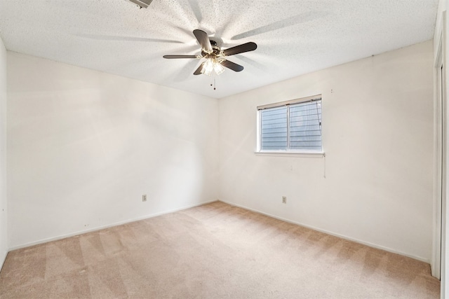 12404 Wycliff Ln, Austin, TX 78727 - carpeted spare room featuring a ceiling fan and a textured ceiling