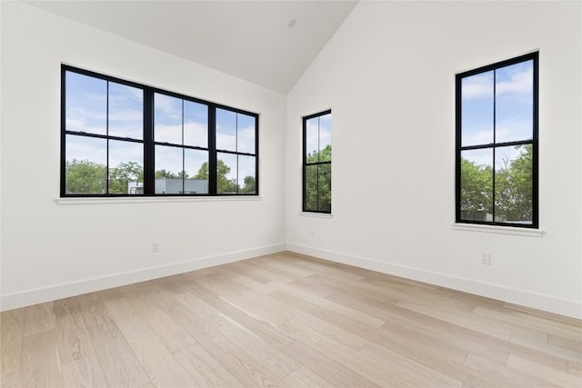 1703 Madison, Austin, TX 78757 - spare room featuring light wood finished floors and high vaulted ceiling