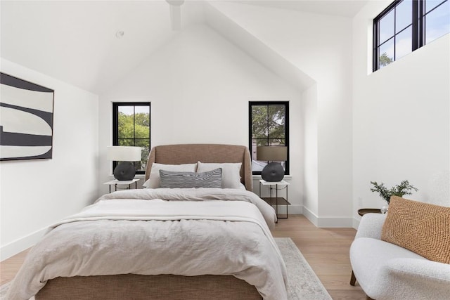 1703 Madison, Austin, TX 78757 - bedroom featuring light wood-style floors and high vaulted ceiling