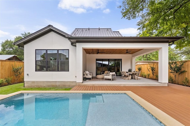 1703 Madison, Austin, TX 78757 - rear view of house featuring a wooden deck, ceiling fan, outdoor lounge area, and stucco siding