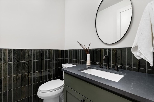 1703 Madison, Austin, TX 78757 - half bath with tile walls, vanity, and a wainscoted wall