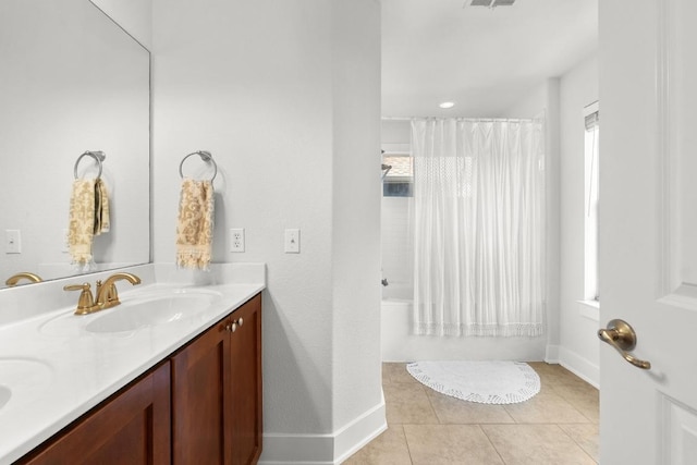 1601 Miriam Ave Unit 100, Austin, TX 78702 - full bathroom featuring double vanity, tile patterned flooring, and shower / bath combo with shower curtain
