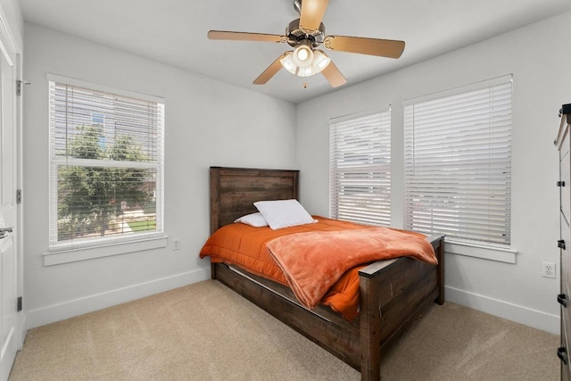 1601 Miriam Ave Unit 100, Austin, TX 78702 - bedroom with light colored carpet and a ceiling fan