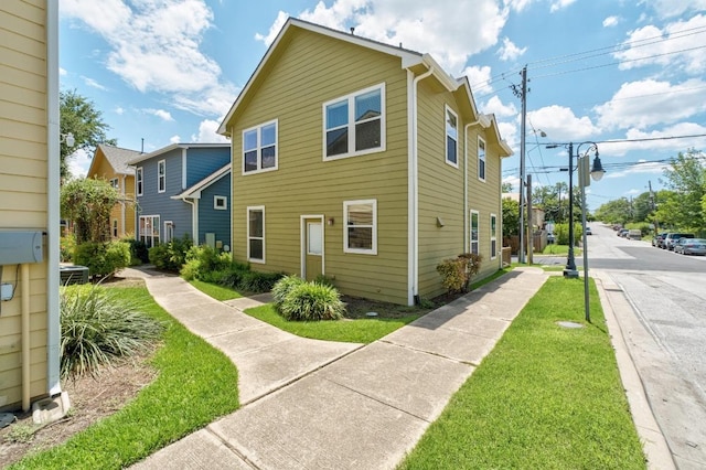 1601 Miriam Ave Unit 100, Austin, TX 78702 - view of property exterior with a lawn