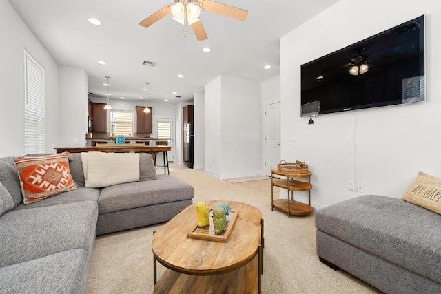 1601 Miriam Ave Unit 100, Austin, TX 78702 - living area featuring light colored carpet, ceiling fan, and recessed lighting