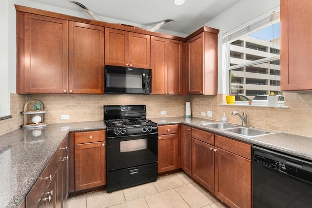 1601 Miriam Ave Unit 100, Austin, TX 78702 - kitchen with black appliances, decorative backsplash, light tile patterned flooring, and brown cabinetry