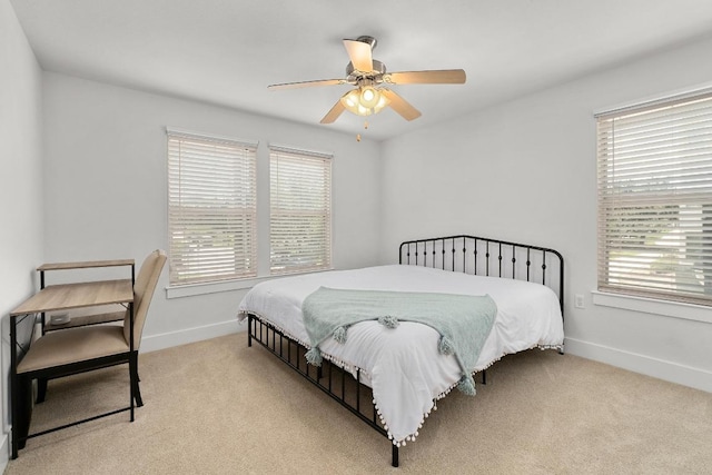1601 Miriam Ave Unit 100, Austin, TX 78702 - carpeted bedroom with baseboards and ceiling fan