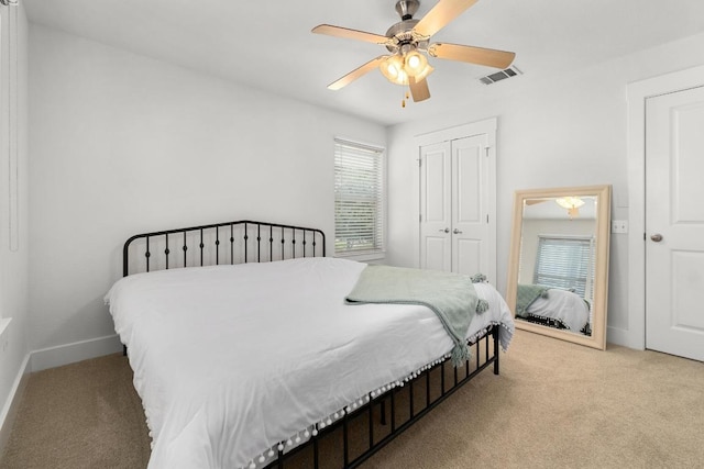 1601 Miriam Ave Unit 100, Austin, TX 78702 - bedroom featuring light carpet, a closet, and a ceiling fan