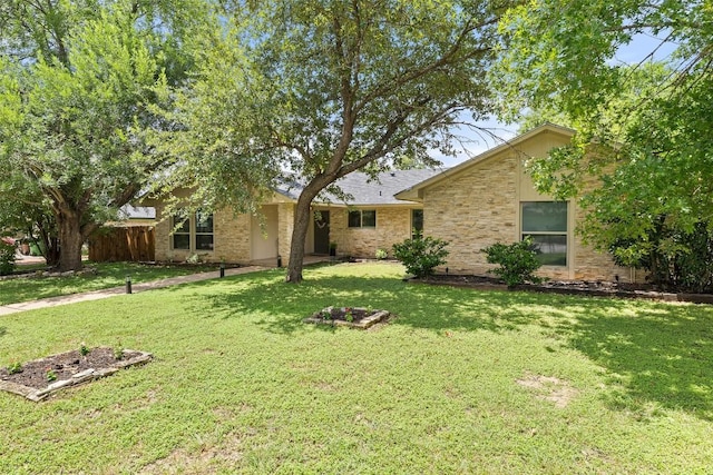 510 Heather Dr, Round Rock, TX 78664 - view of front facade featuring a front yard and stone siding