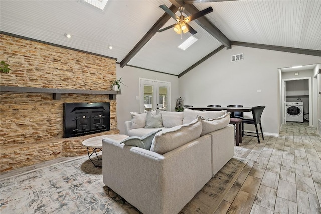 510 Heather Dr, Round Rock, TX 78664 - living room with washer / dryer, ceiling fan, wood finished floors, french doors, and a skylight