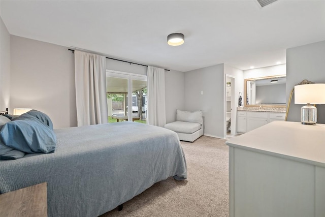 510 Heather Dr, Round Rock, TX 78664 - bedroom featuring light colored carpet, connected bathroom, access to outside, and recessed lighting