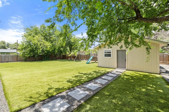 510 Heather Dr, Round Rock, TX 78664 - fenced backyard with a playground and an outbuilding