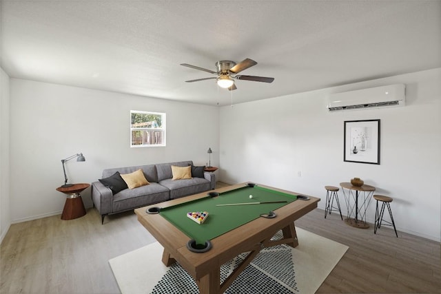 510 Heather Dr, Round Rock, TX 78664 - rec room with a wall mounted AC, wood finished floors, pool table, and a ceiling fan