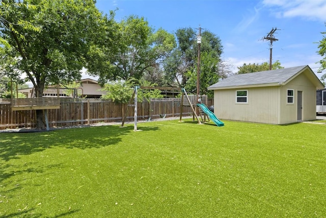 510 Heather Dr, Round Rock, TX 78664 - fenced backyard featuring a playground and an outdoor structure