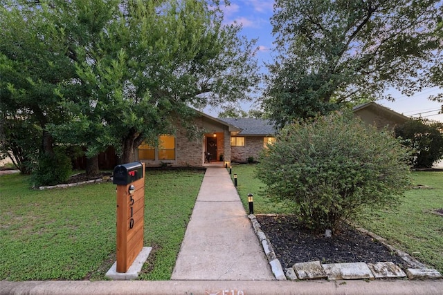 510 Heather Dr, Round Rock, TX 78664 - view of front of home with a front lawn and brick siding