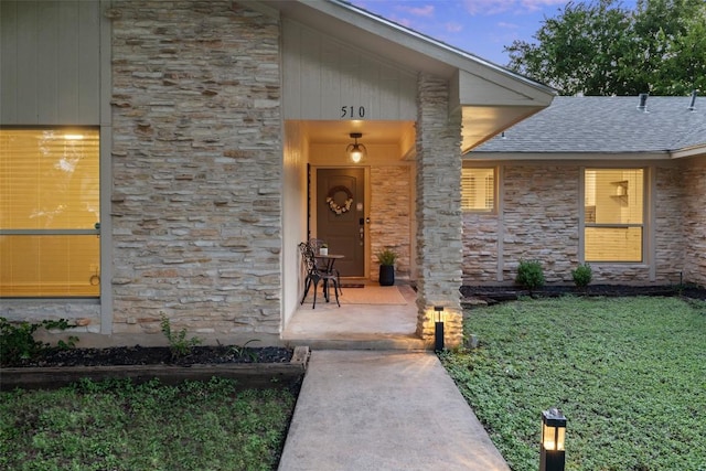 510 Heather Dr, Round Rock, TX 78664 - view of exterior entry featuring stone siding and a shingled roof