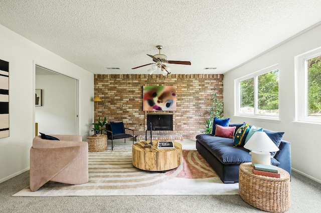 4009 Cordova Dr, Austin, TX 78759 - carpeted living room with ceiling fan, a fireplace, and a textured ceiling