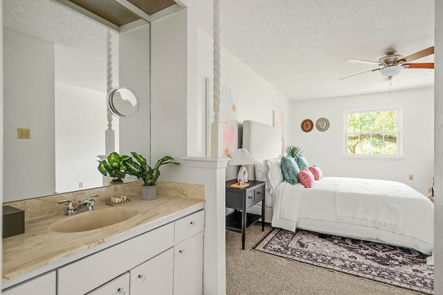 4009 Cordova Dr, Austin, TX 78759 - bedroom featuring a textured ceiling and carpet floors