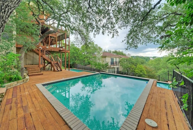 6605 Ladera Norte, Austin, TX 78731 - view of swimming pool featuring stairs and a wooden deck