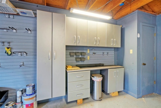 6605 Ladera Norte, Austin, TX 78731 - kitchen with light countertops and wood walls