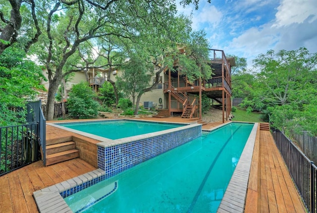 6605 Ladera Norte, Austin, TX 78731 - swimming pool featuring a wooden deck and stairs