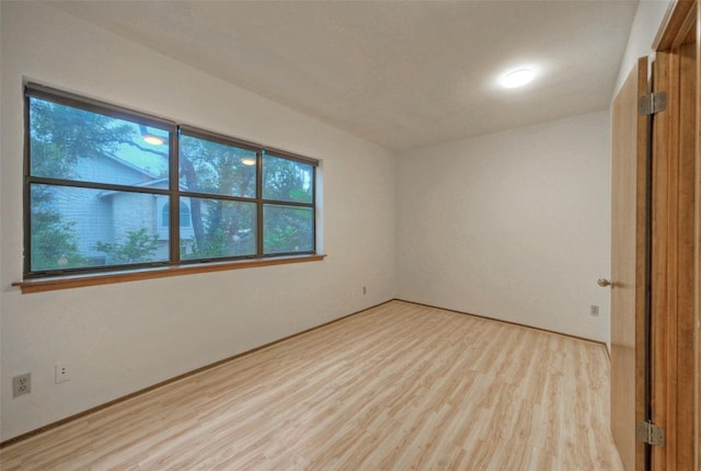 6605 Ladera Norte, Austin, TX 78731 - empty room with wood finished floors and plenty of natural light