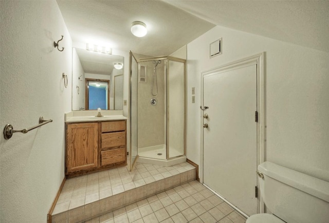 6605 Ladera Norte, Austin, TX 78731 - bathroom featuring tile patterned flooring, a shower stall, vanity, and vaulted ceiling