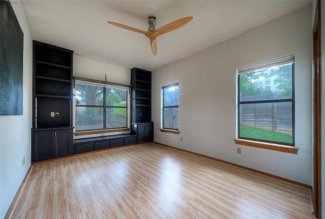 6605 Ladera Norte, Austin, TX 78731 - spare room featuring plenty of natural light, light wood-type flooring, and ceiling fan