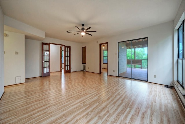 6605 Ladera Norte, Austin, TX 78731 - spare room with light wood-type flooring, french doors, and a ceiling fan