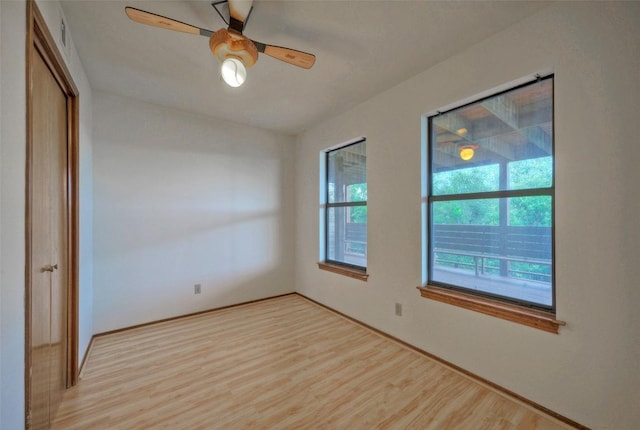 6605 Ladera Norte, Austin, TX 78731 - spare room with healthy amount of natural light, light wood-style flooring, and a ceiling fan