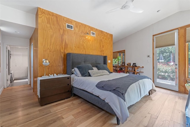 1407 Spring Gdn, Austin, TX 78746 - bedroom featuring vaulted ceiling, light wood-type flooring, and access to outside